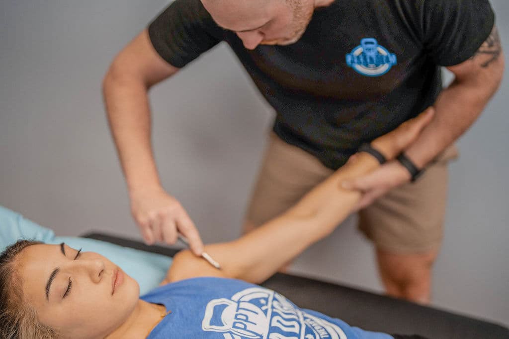 Patient working with a provider at a running physical therapy clinic in Wilmington, NC