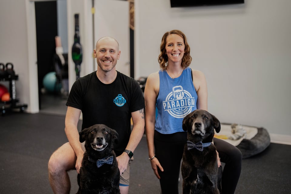 Clinic owners Collen and Sean Rollo with their dogs!